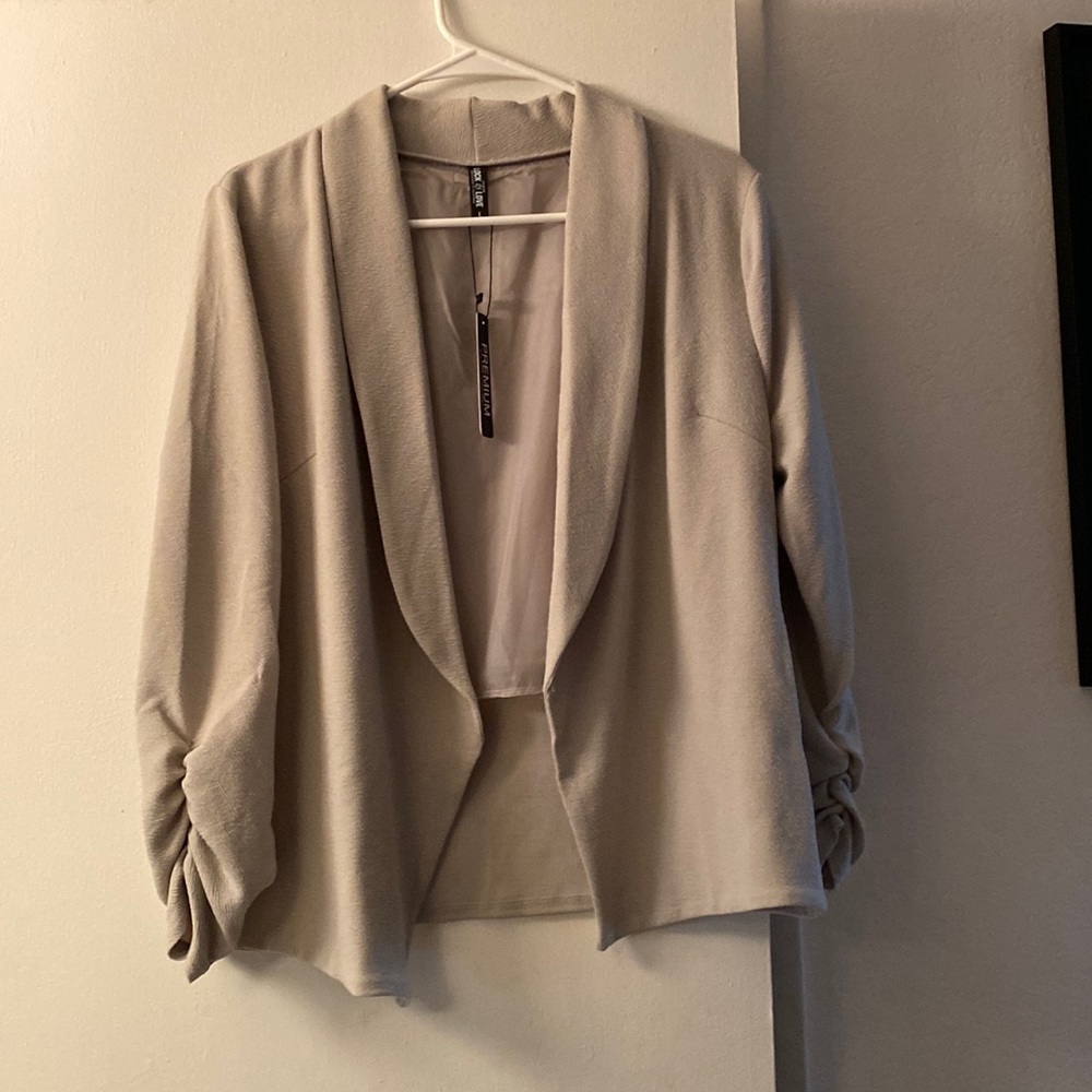 Light gray women’s blazer, never worn.